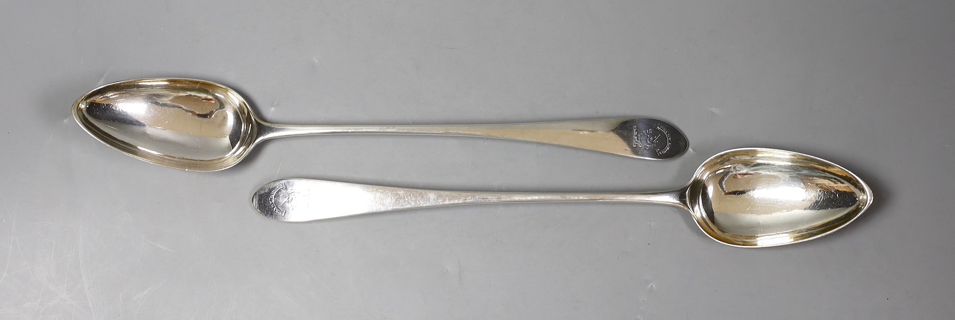 A pair of George III Scottish silver Celtic tip basting spoons, with engraved crest, Patrick Robertson, Edinburgh, 1790, 33.2cm, 7oz.